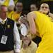 Michigan freshman Nik Stauskas holds a towel to his head as he gushes blood after a collision on the court during the first half against Michigan State at Crisler Center on Sunday, March 3, 2013. Melanie Maxwell I AnnArbor.com